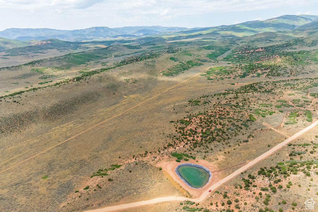 Birds eye view of property with a mountain view