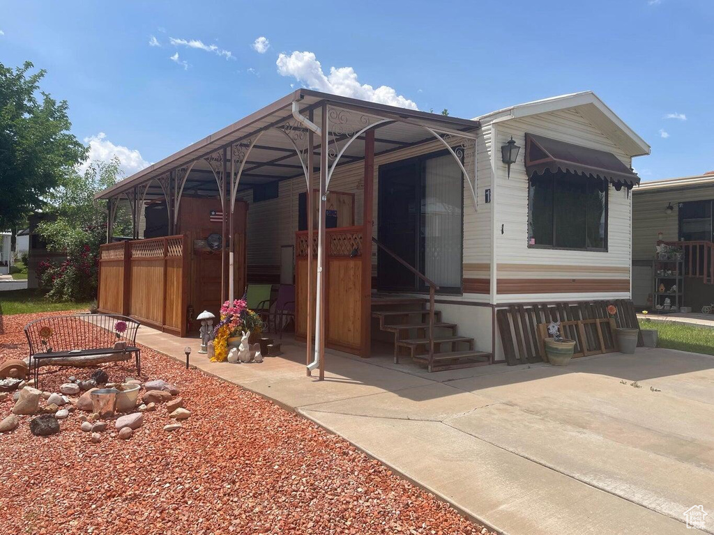 Back of house with a patio area