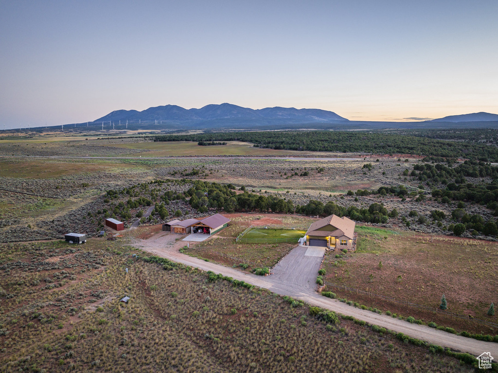 Aerial view at dusk with a mountain view and a rural view