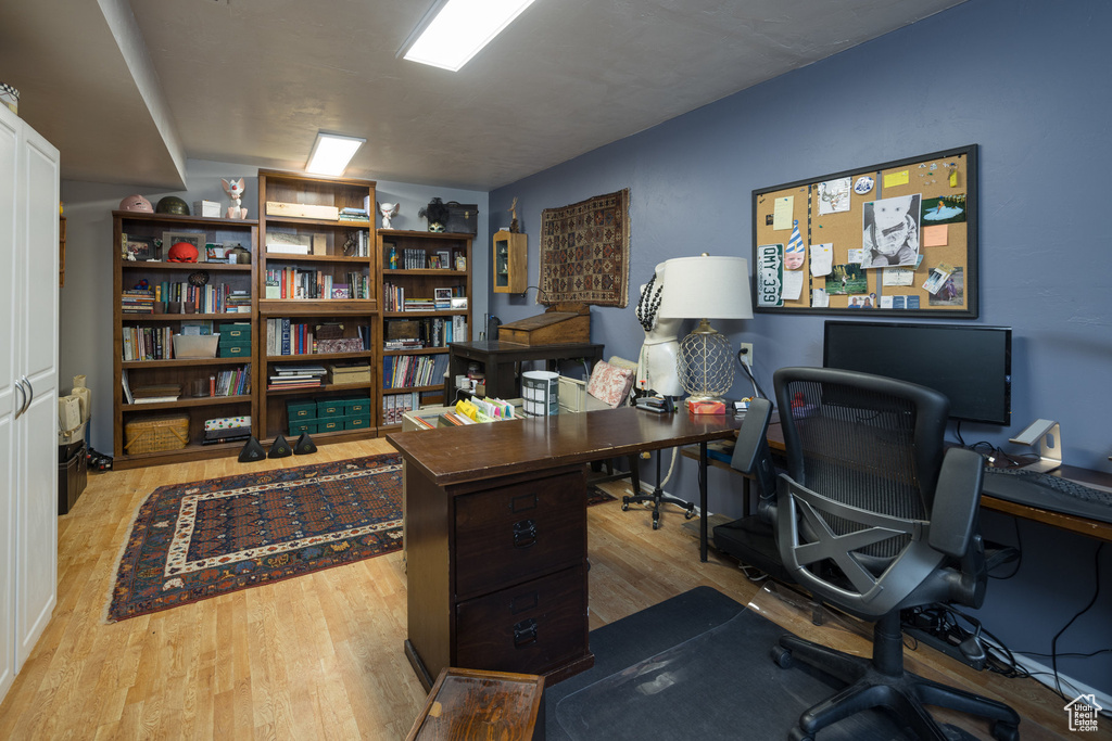 Office area featuring light hardwood / wood-style flooring