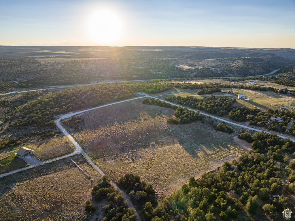 Aerial view at dusk featuring a rural view