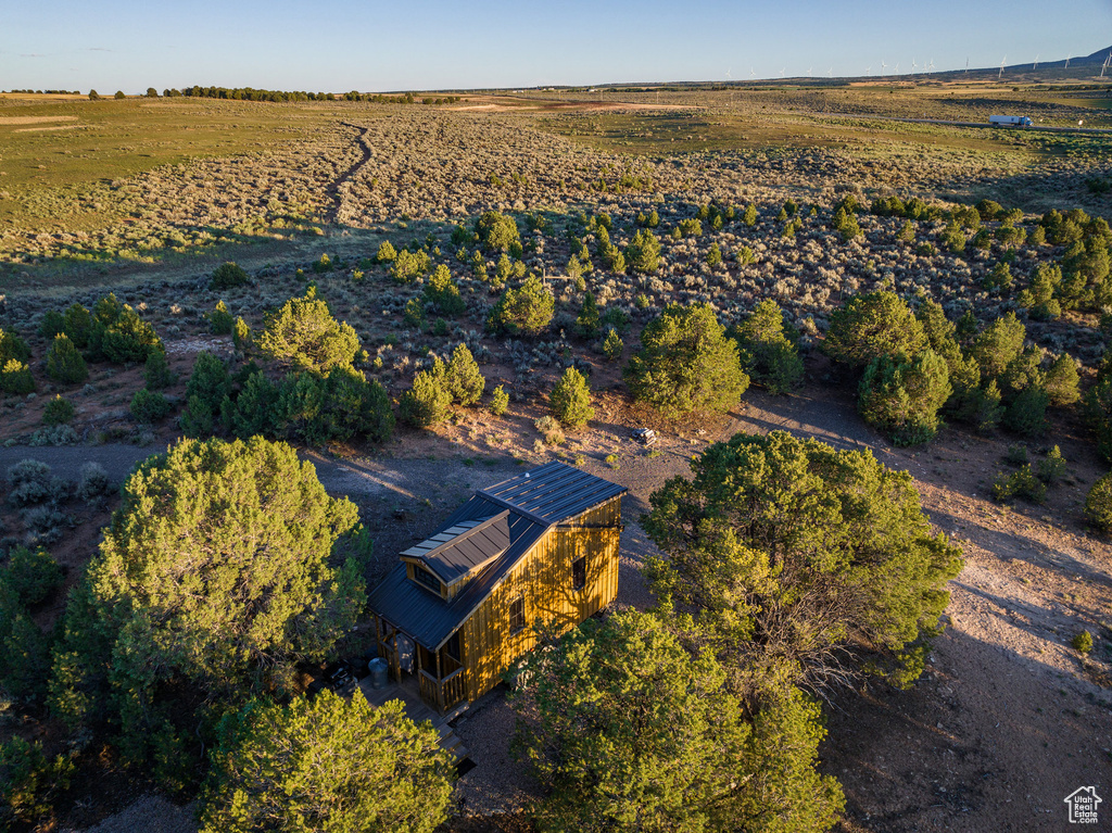 Birds eye view of property with a rural view