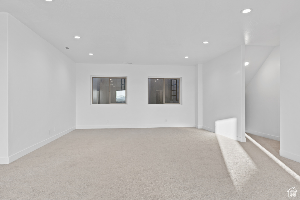 Carpeted spare room with recessed lighting