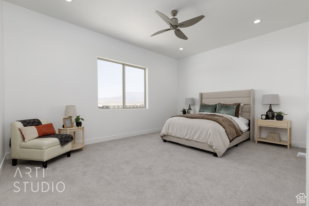 Carpeted bedroom with ceiling fan