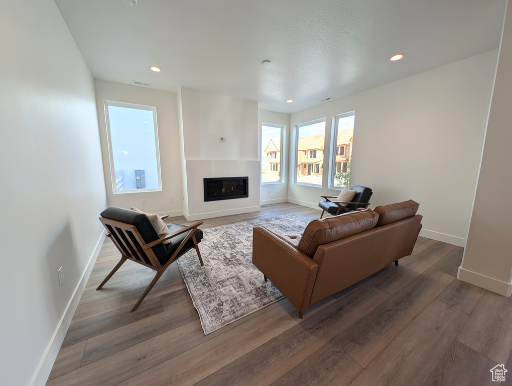 Living room with hardwood / wood-style flooring