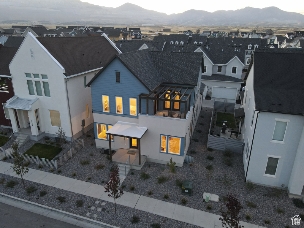 Rear view of property with a mountain view