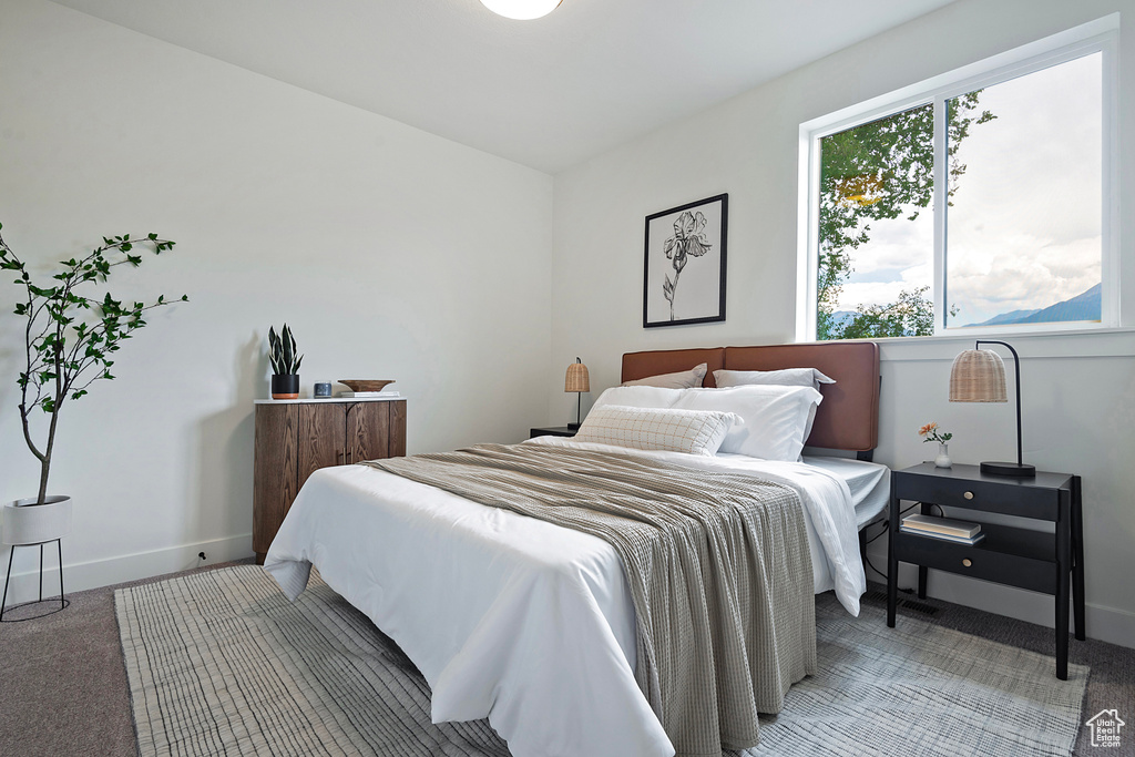 Bedroom with light carpet