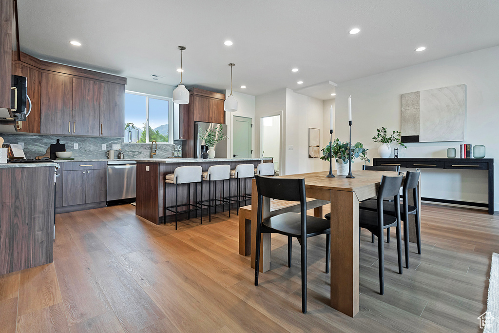 Dining room featuring light wood-type flooring