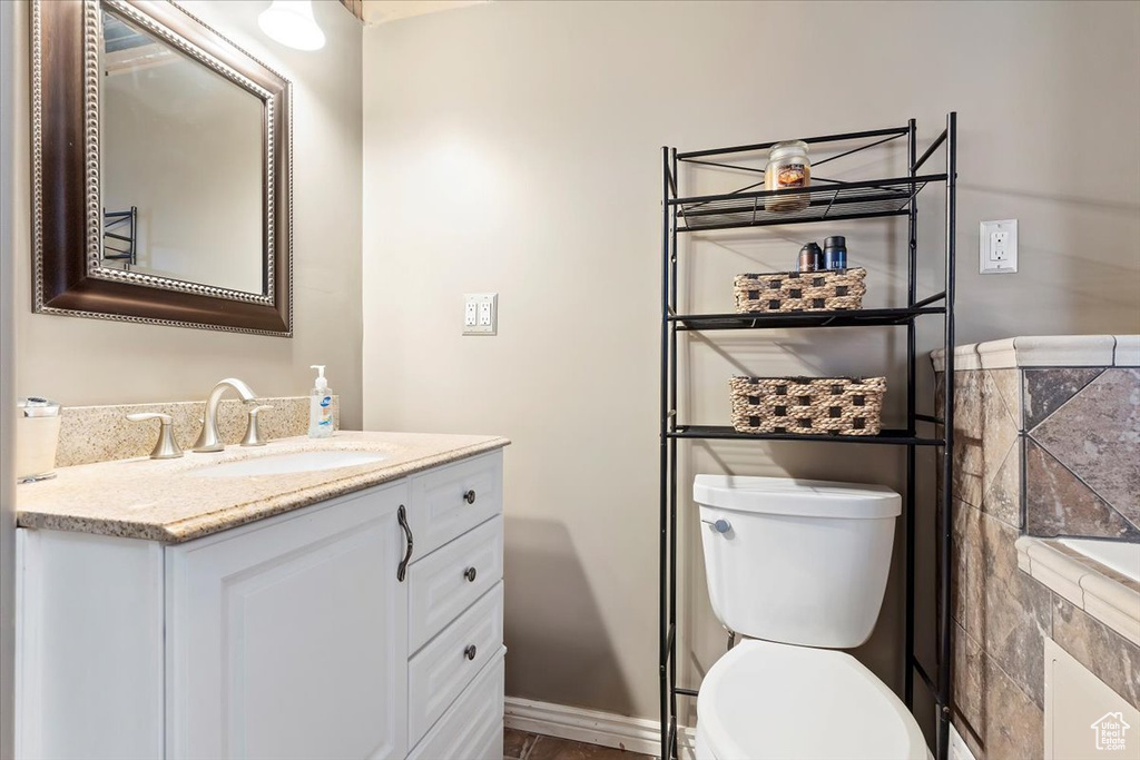 Bathroom featuring vanity and toilet