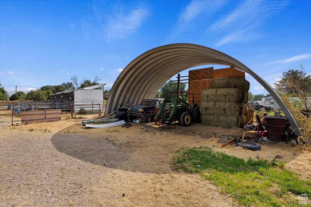 View of outbuilding featuring a carport