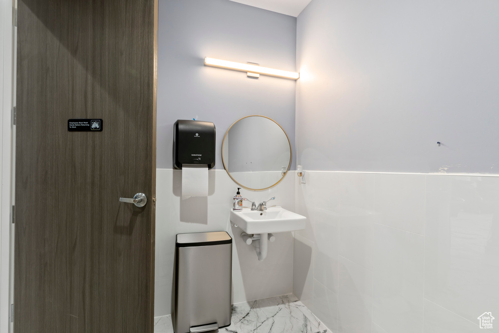 Bathroom featuring tile patterned floors and sink