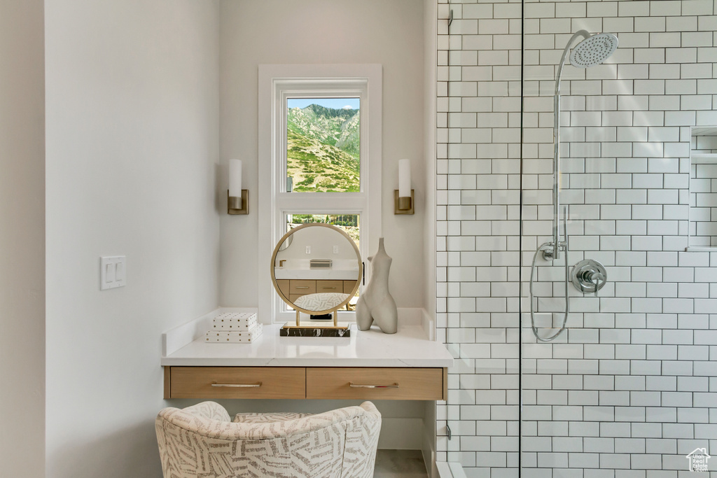 Bathroom with a tile shower and vanity