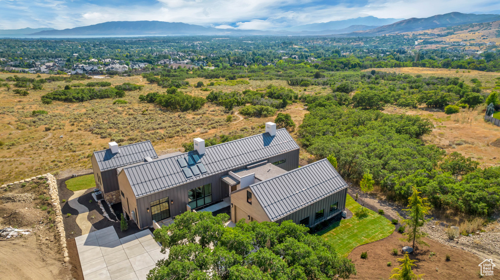 Birds eye view of property with a mountain view