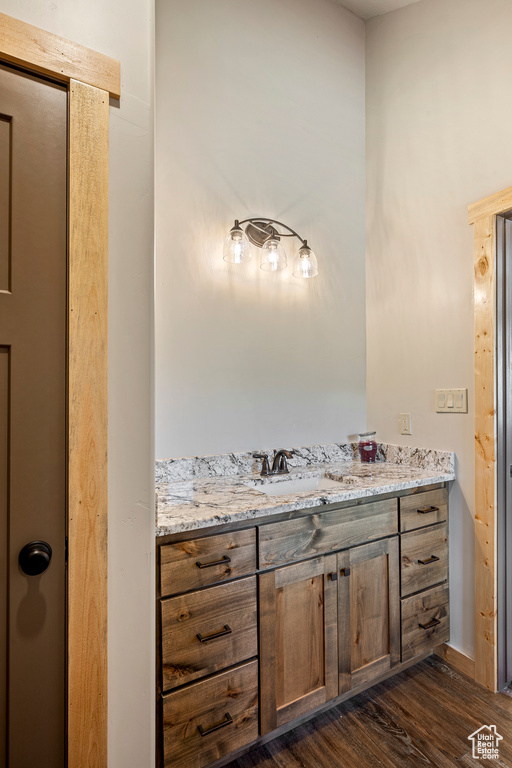 Bathroom with vanity and hardwood / wood-style floors