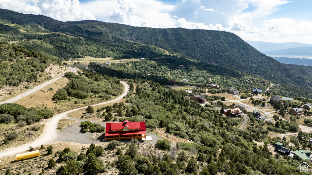 Birds eye view of property with a mountain view