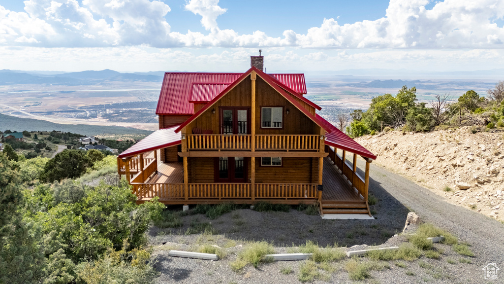View of front facade featuring a deck with mountain view