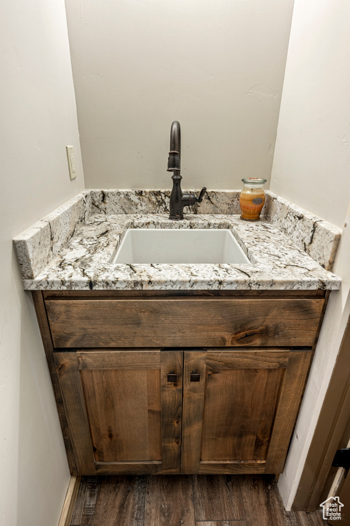 Bathroom with vanity and hardwood / wood-style floors