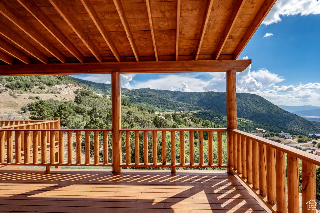 Wooden deck featuring a mountain view