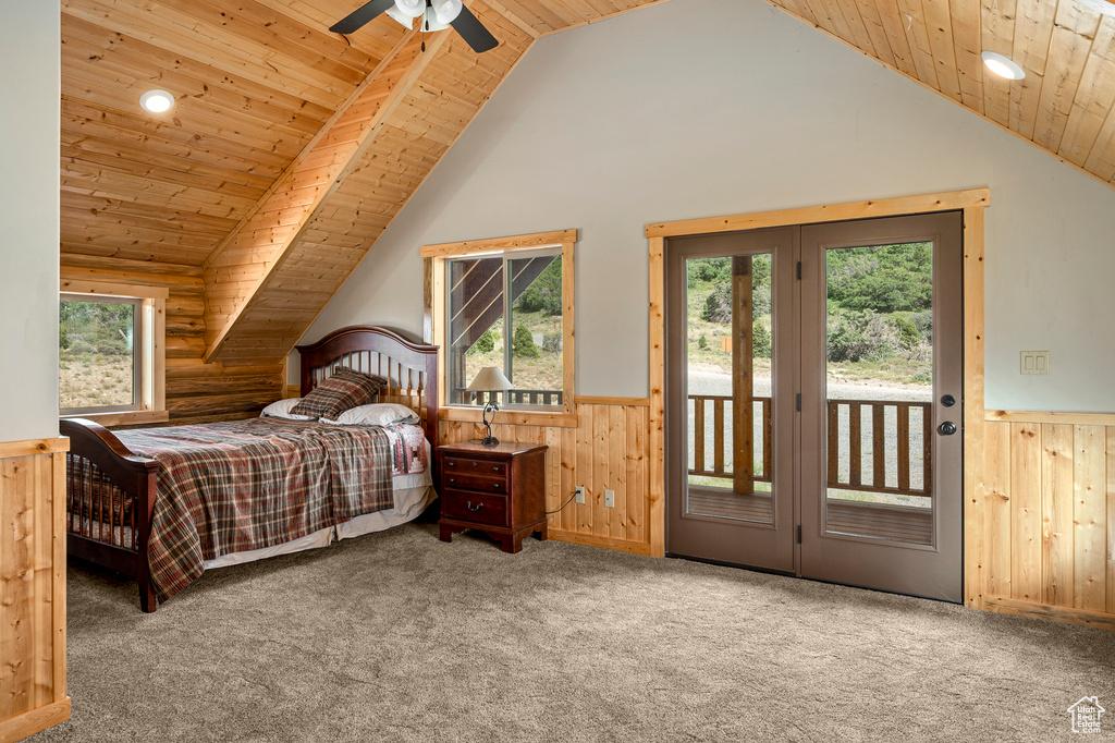 Bedroom featuring carpet flooring, access to outside, vaulted ceiling, and wooden ceiling
