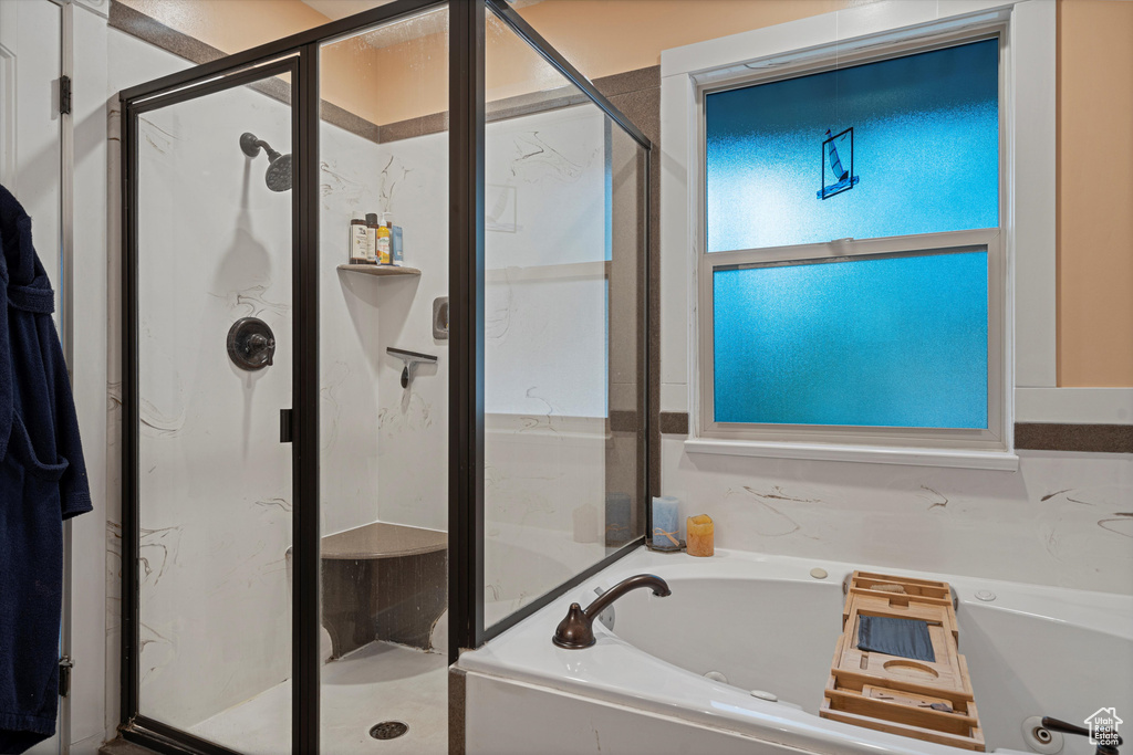 Bathroom featuring plus walk in shower