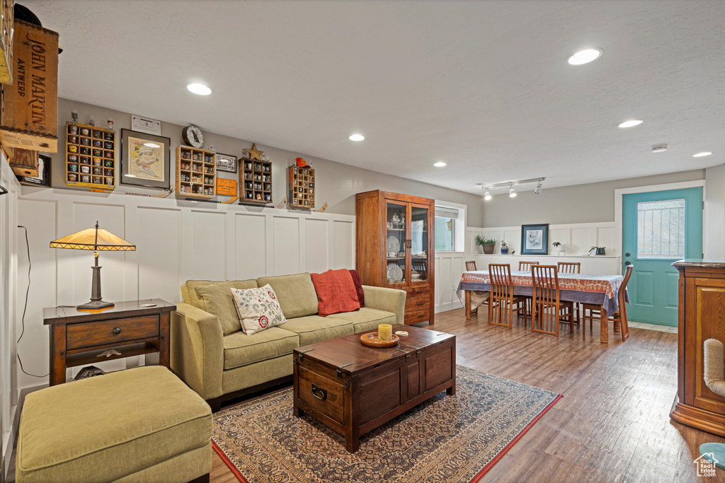 Living room featuring hardwood / wood-style floors and track lighting