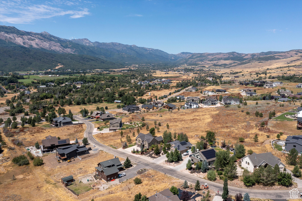 Birds eye view of property with a mountain view