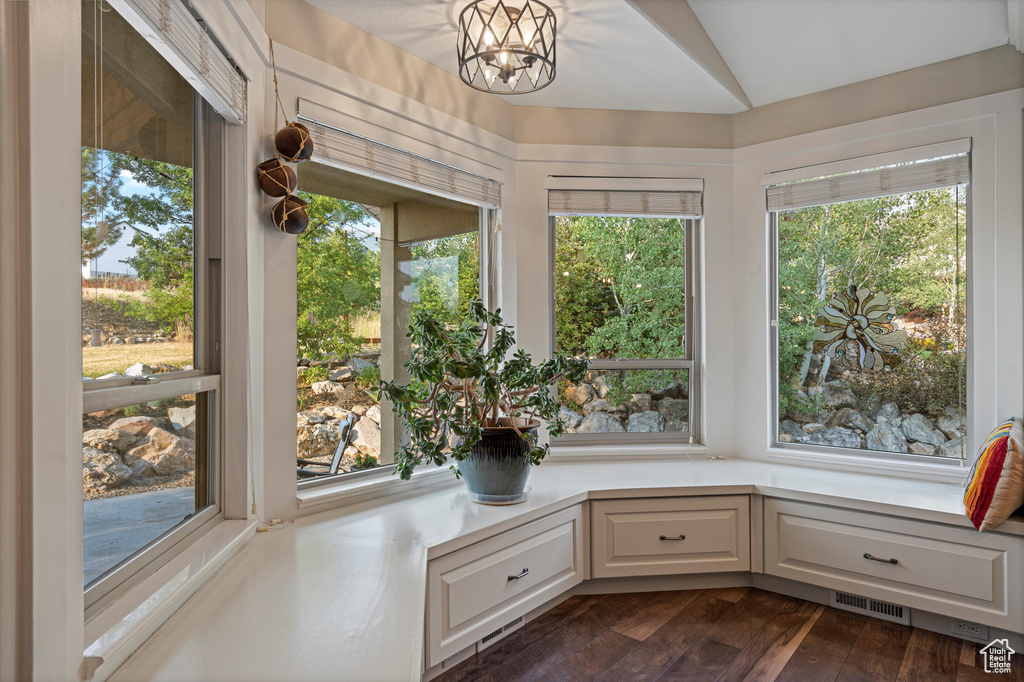 Unfurnished sunroom with a chandelier