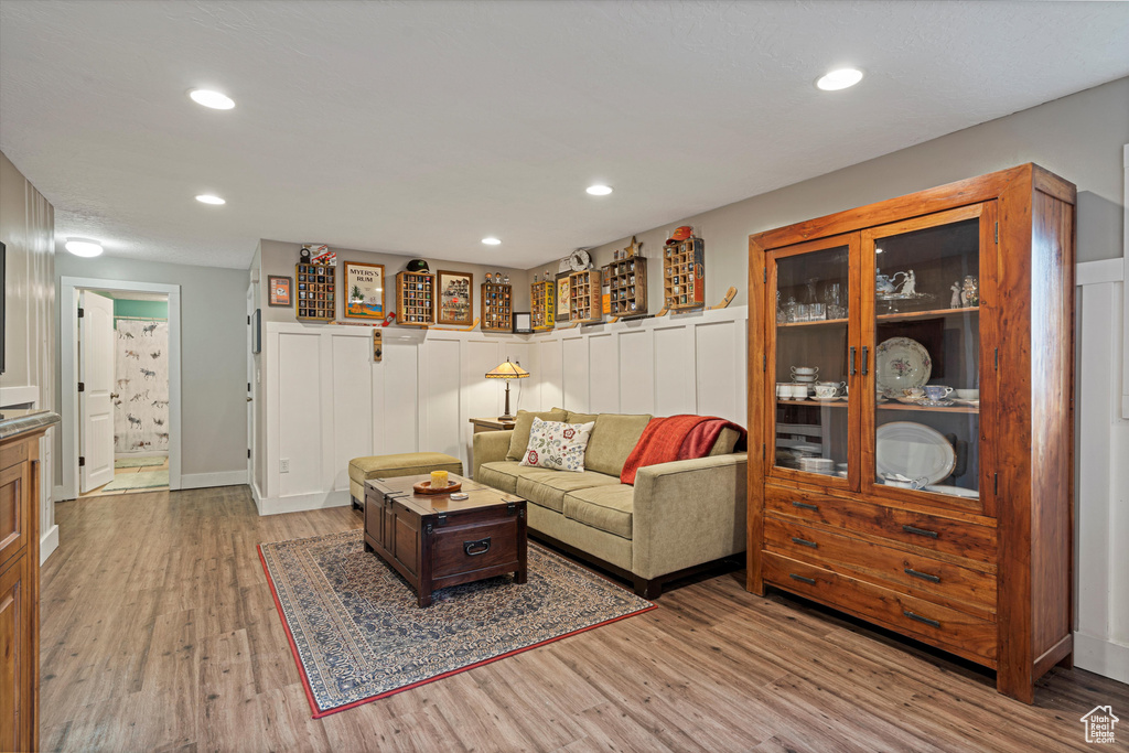 Living room with light hardwood / wood-style floors