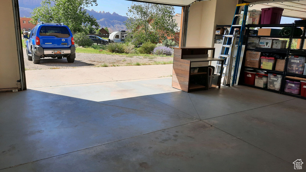 Garage featuring a mountain view