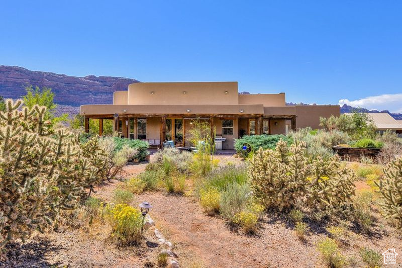 Back of property featuring a mountain view