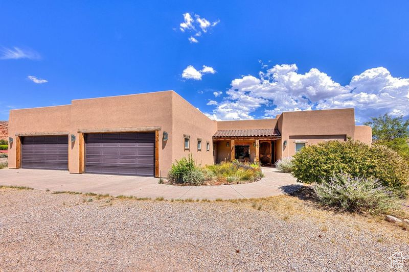 Southwest-style home with a garage