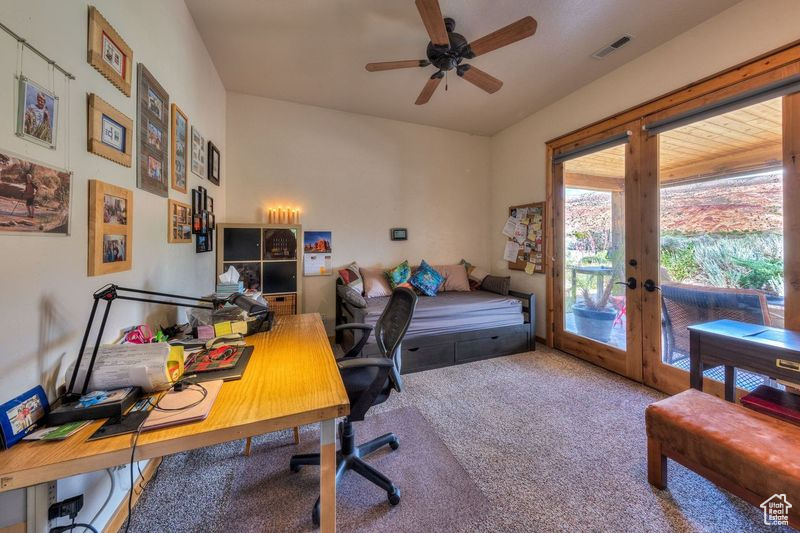 Office featuring ceiling fan, french doors, and carpet