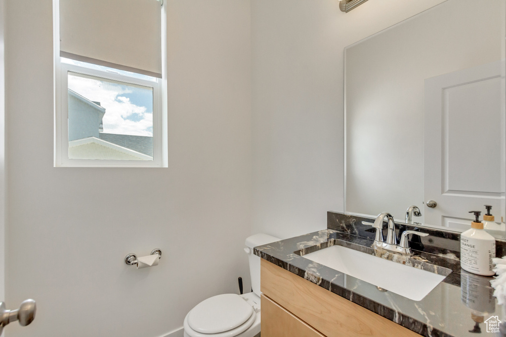 Bathroom featuring toilet and vanity