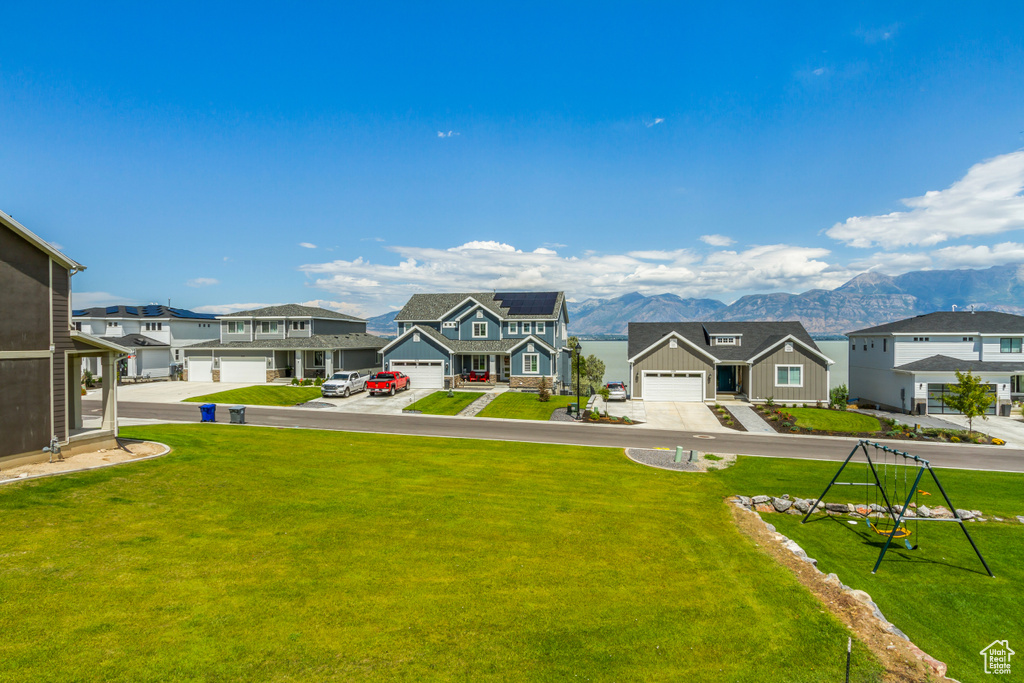 View of yard featuring a garage and a mountain view