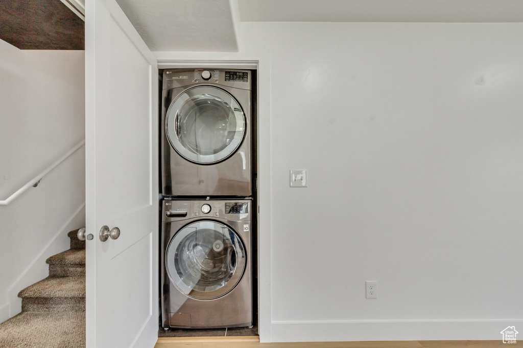 Clothes washing area with stacked washer / drying machine