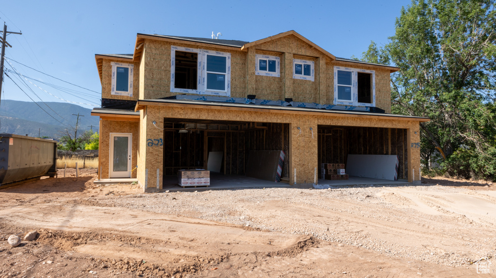 View of front of property with a garage