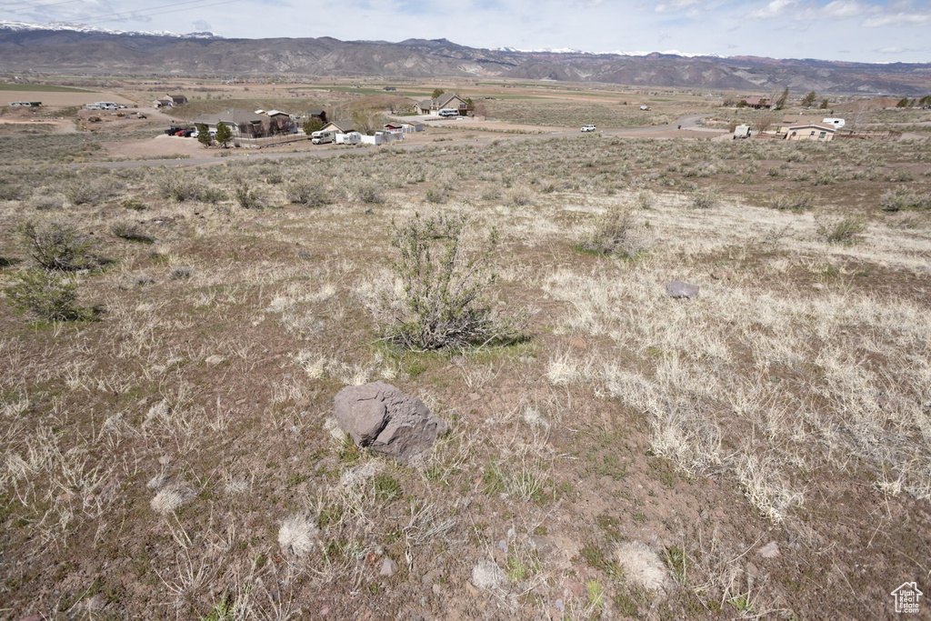 Aerial view featuring a rural view and a mountain view