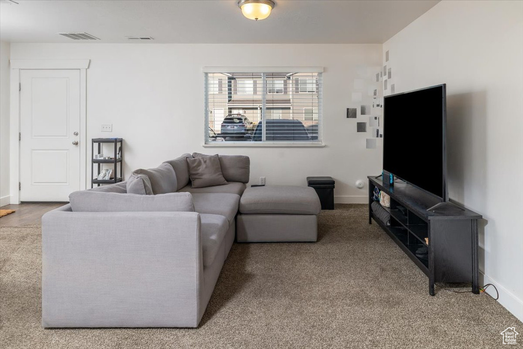 Living room featuring light carpet