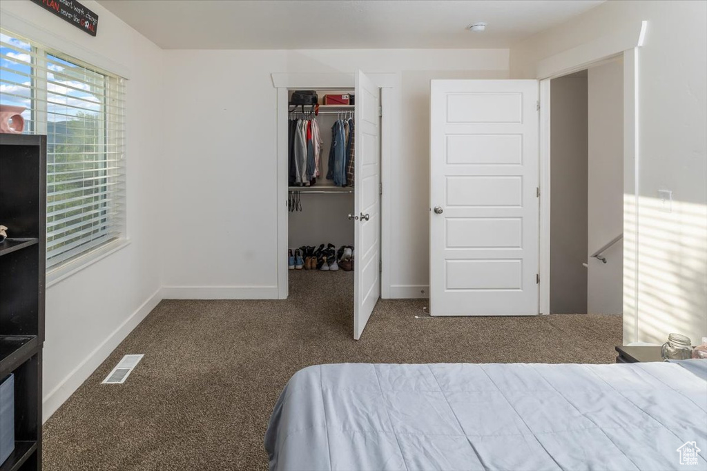 Bedroom featuring a closet and carpet floors