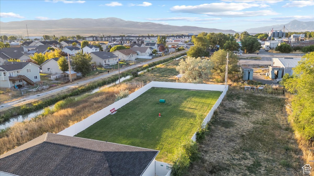 Birds eye view of property with a mountain view