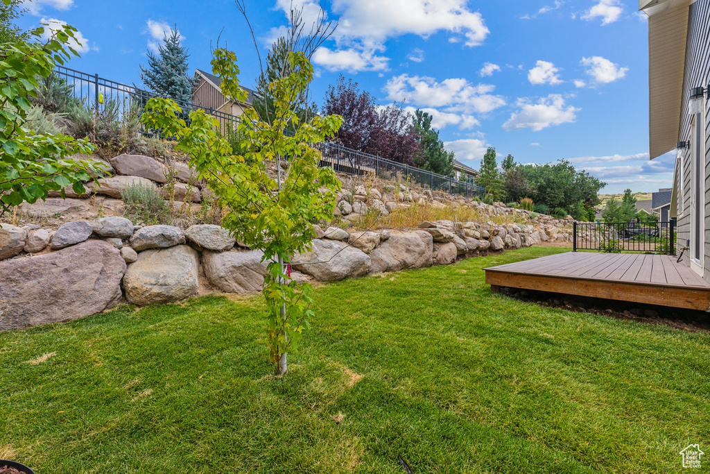 View of yard with a deck