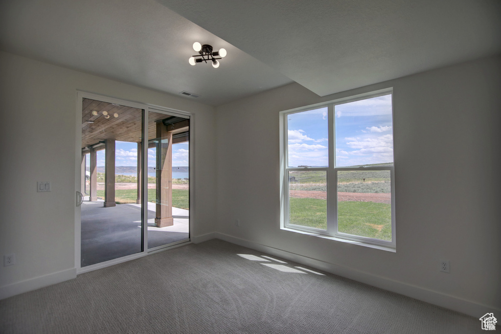 Empty room with carpet floors