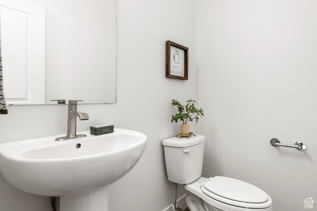 Bathroom with sink and toilet