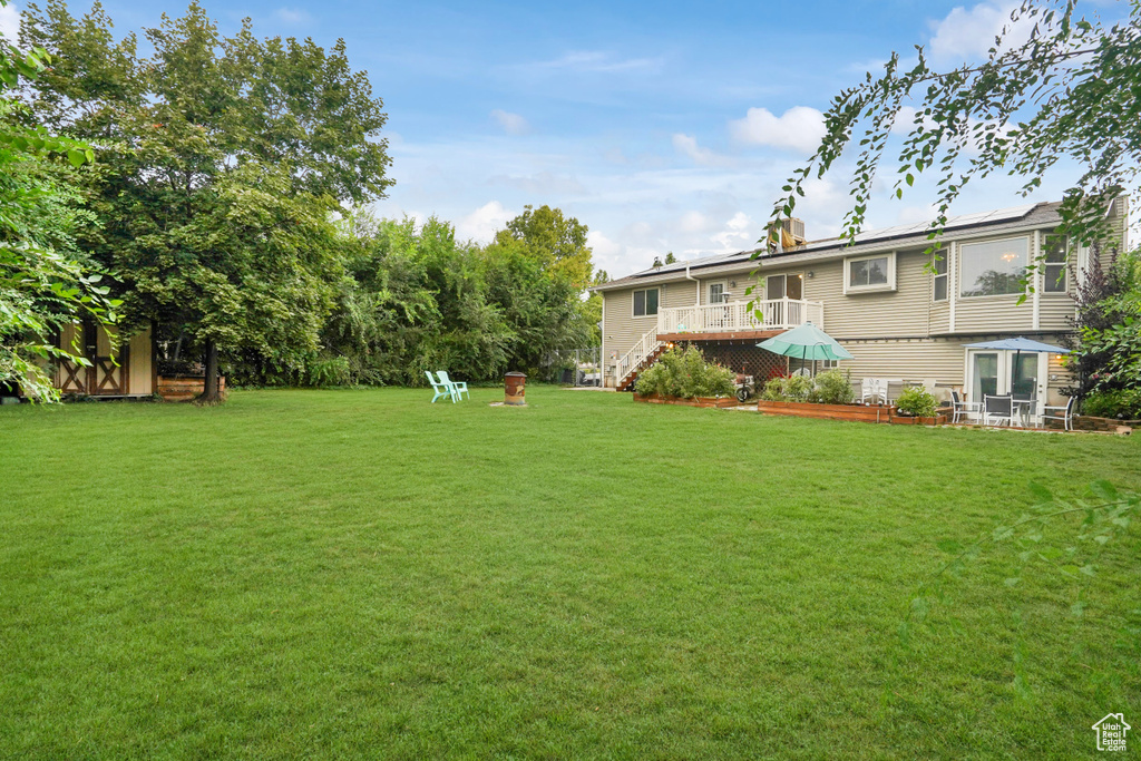 View of yard with a deck