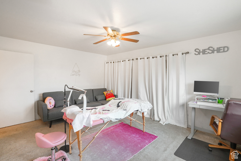 Carpeted bedroom with ceiling fan