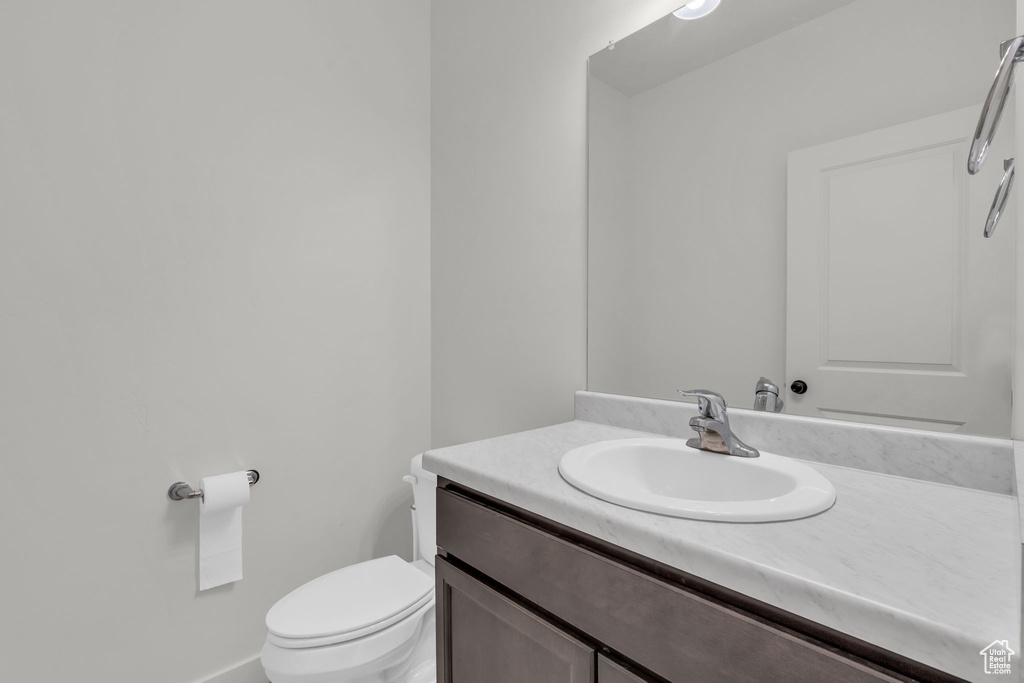 Bathroom featuring vanity and toilet