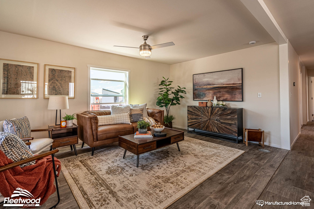 Living room featuring hardwood / wood-style floors and ceiling fan