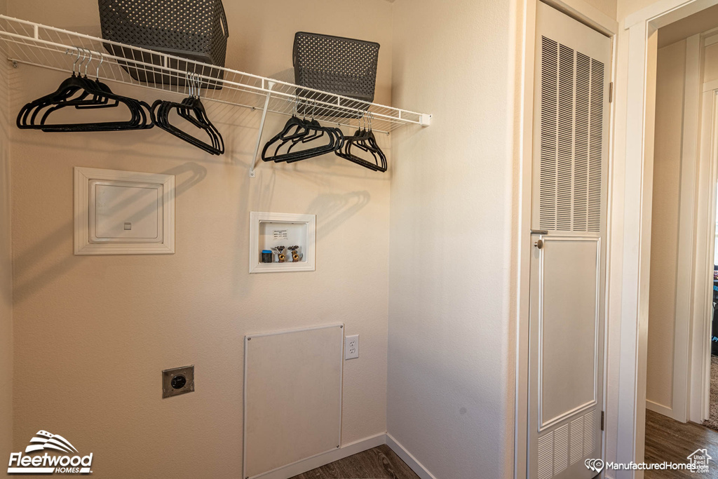 Washroom with hookup for a washing machine, dark wood-type flooring, and electric dryer hookup