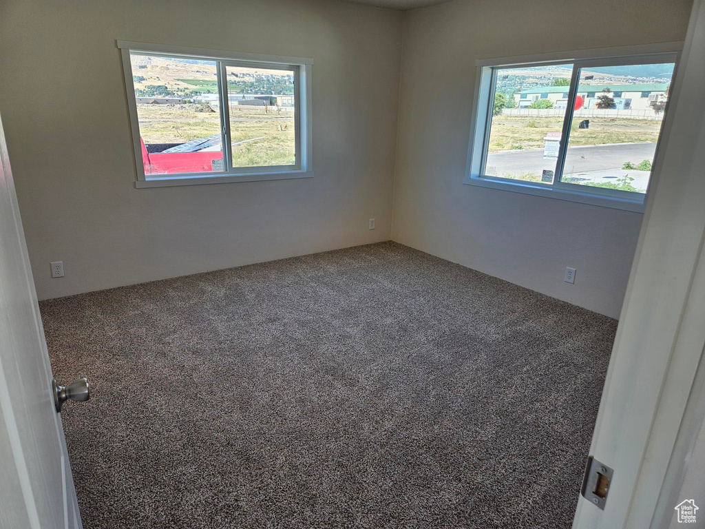 View of carpeted spare room