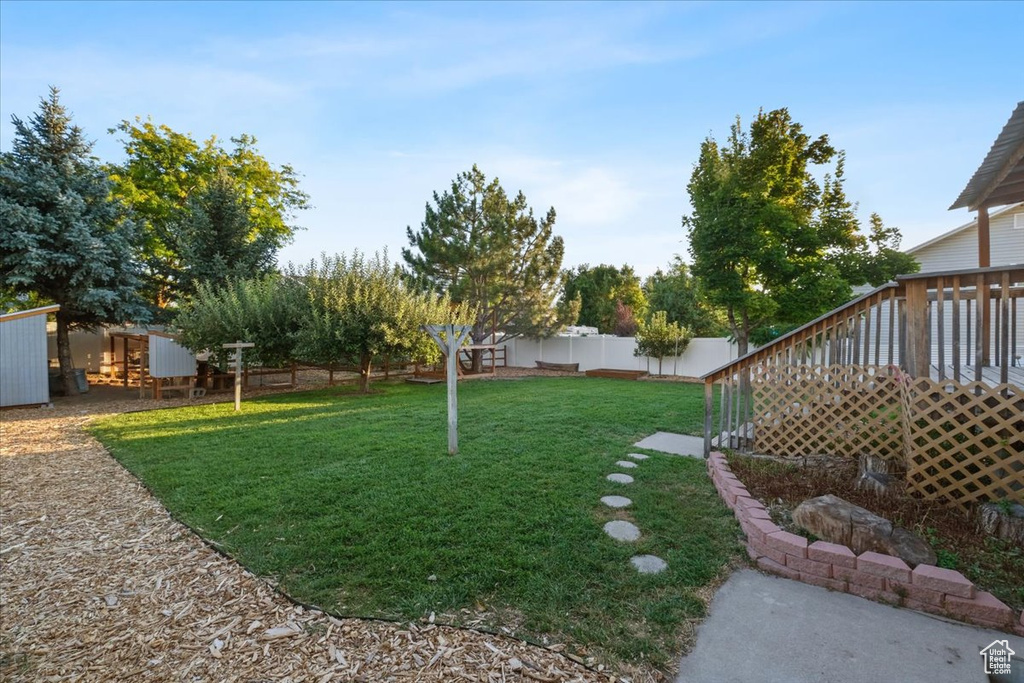 View of yard with a wooden deck